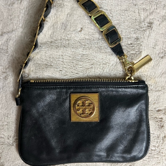 Tory Burch Black and Gold Clutch with Leather Finish and Zipper Closure